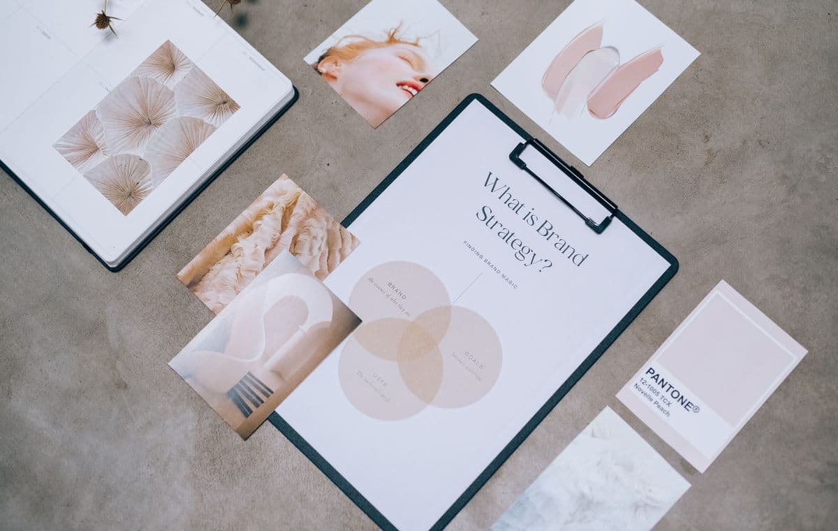 Designer working on brand materials at a desk