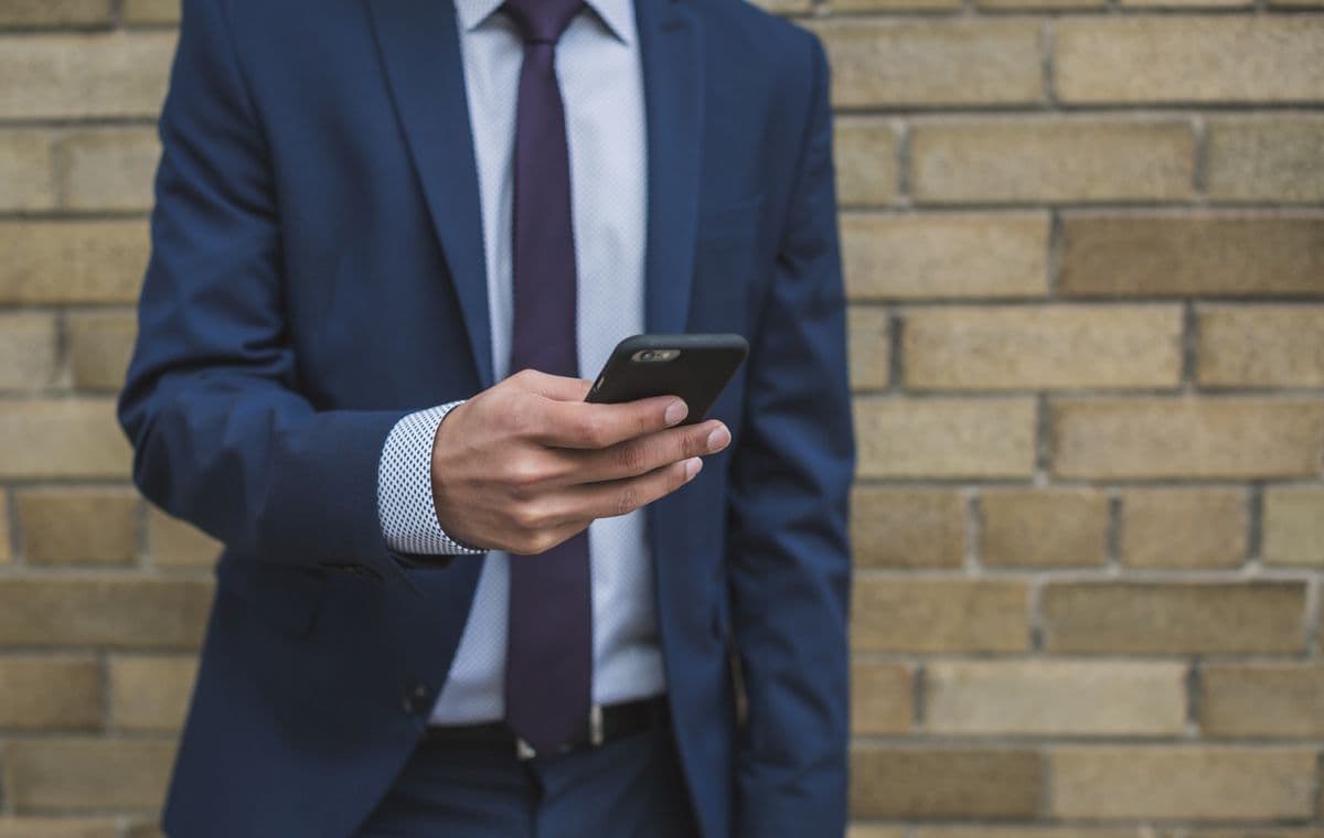 Professional reviewing their online profile on a phone