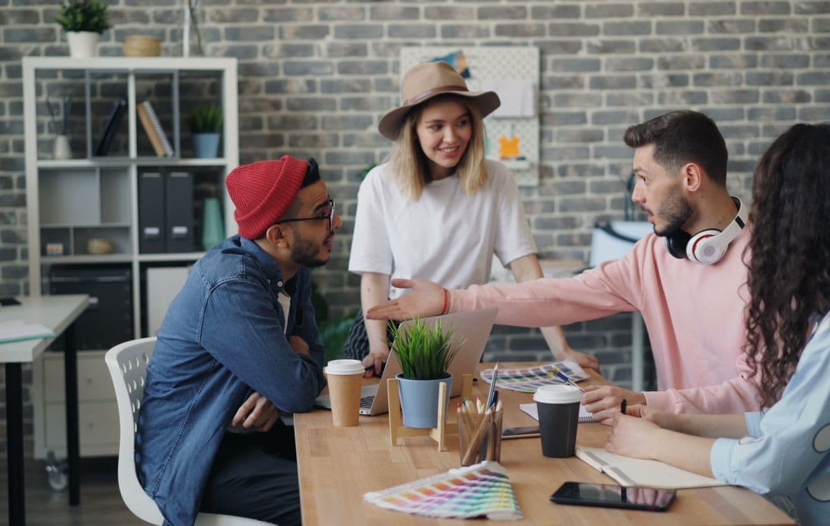 Reputation management team working together in an office