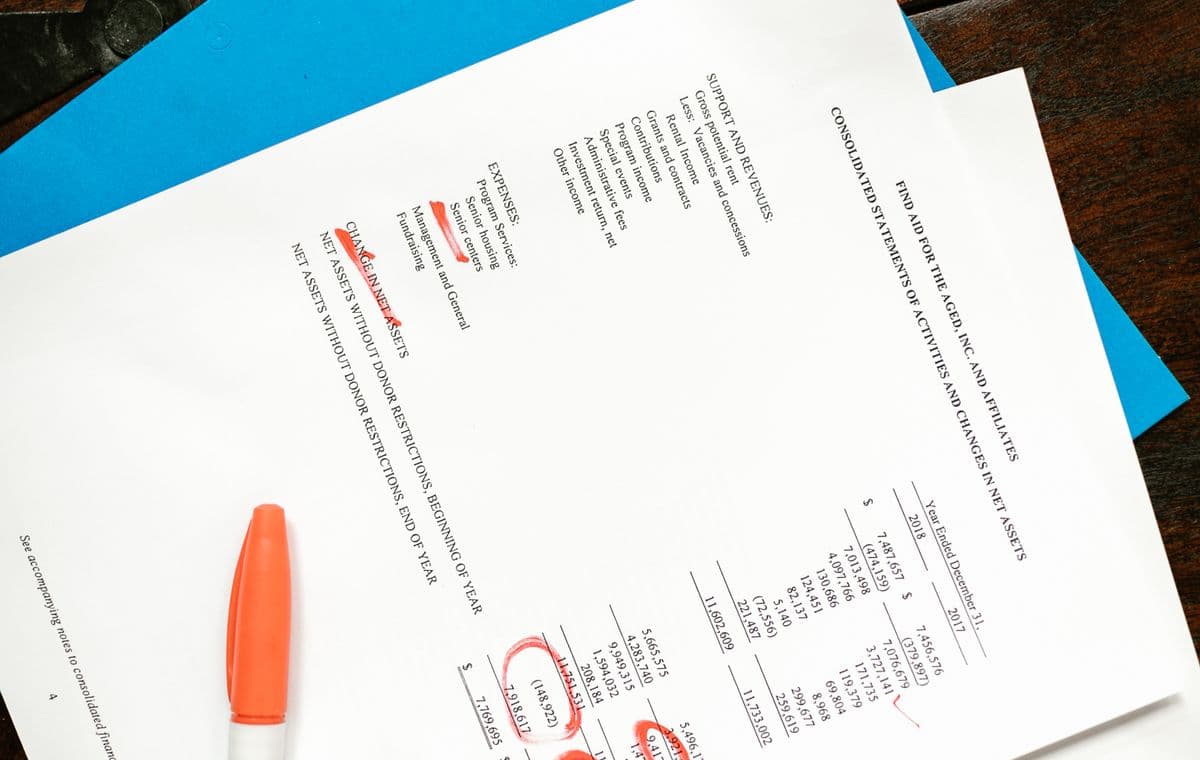 Person reviewing a plan and figures at a desk