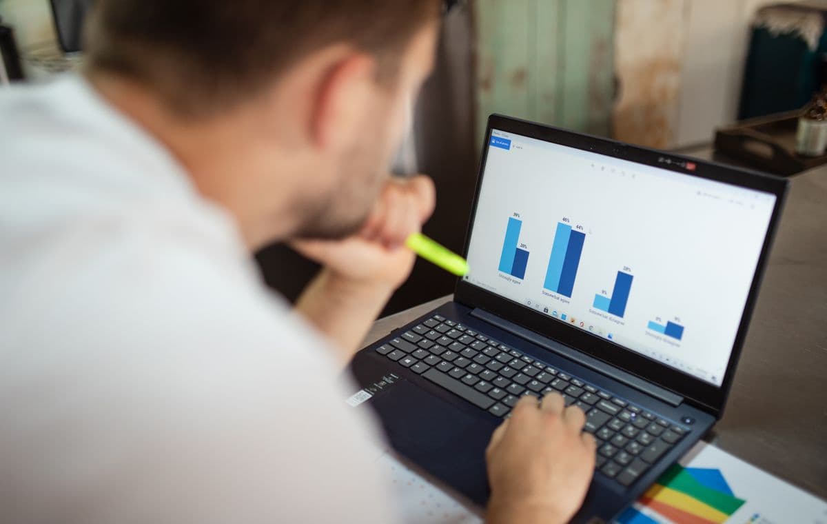 Analyst reviewing search results on a laptop